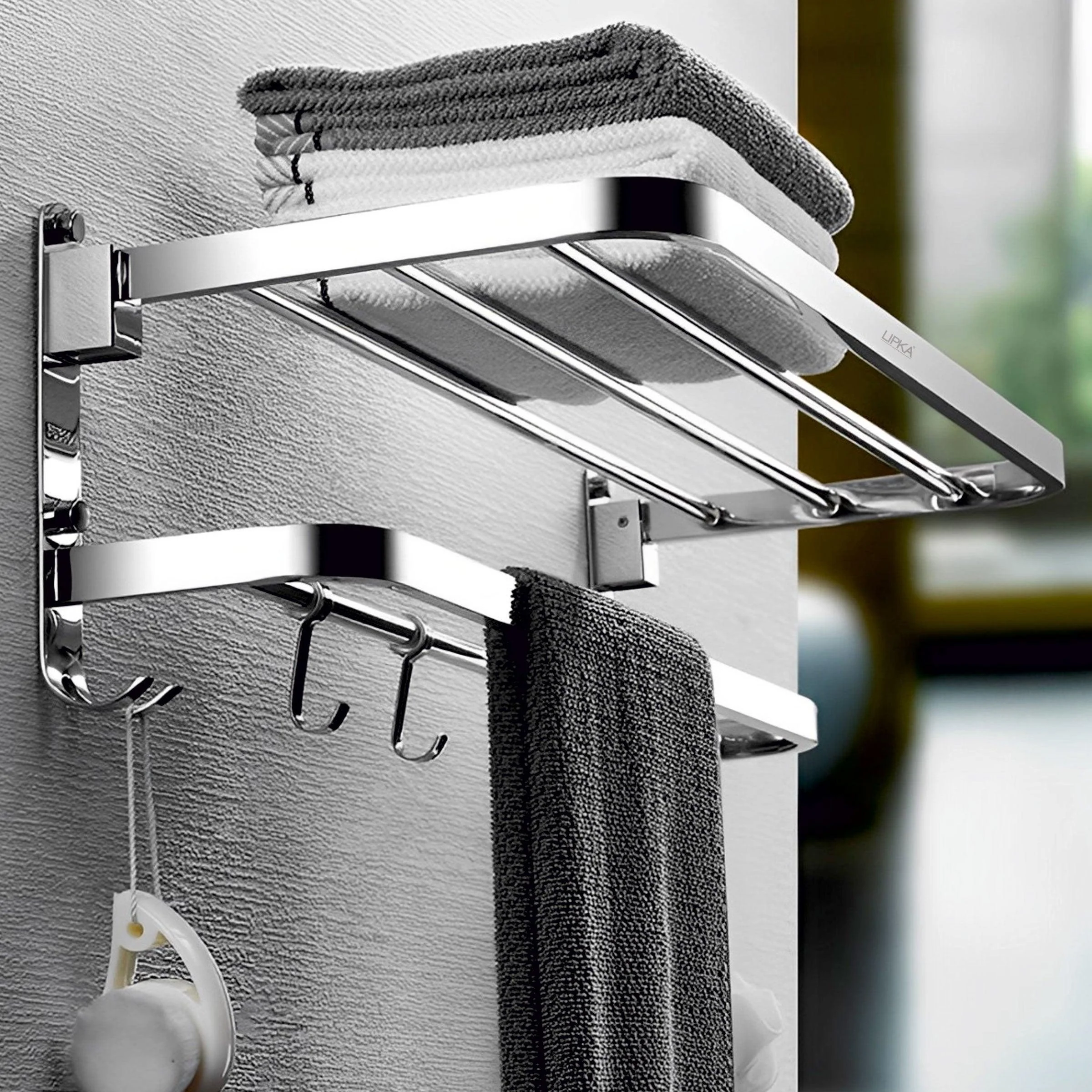 Dual folding towel rack for space-saving bathroom organization.