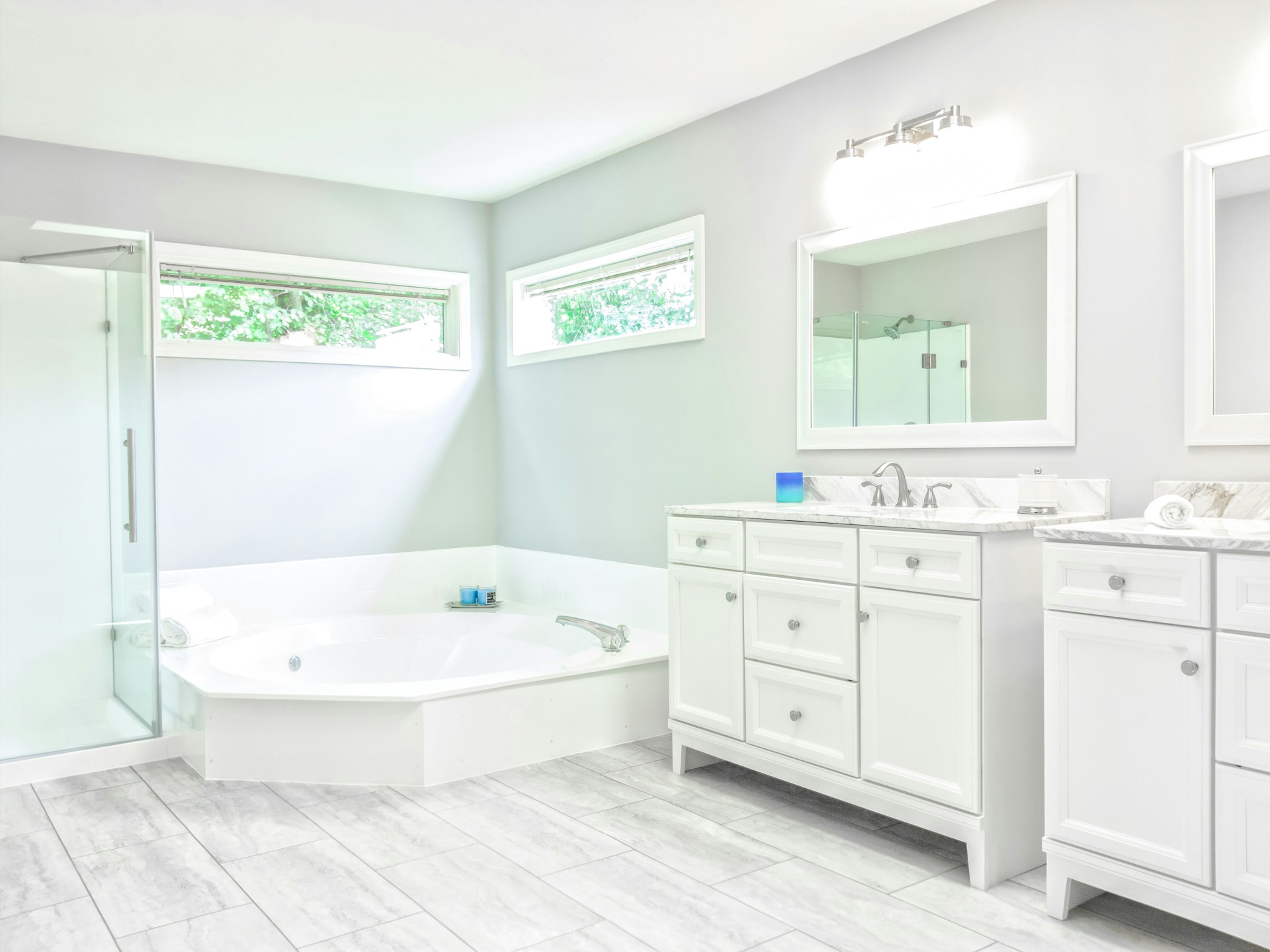 Luxurious modern bathroom with a standalone tub and elegant fixtures, representing the elevated bath experience by NexaBath.